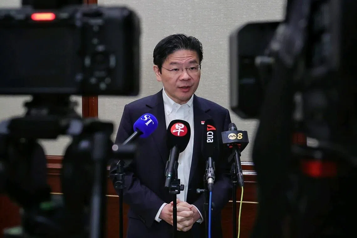 Prime Minister Lawrence Wong speaking to reporters during a media wrap-up in Hong Kong on Mar 28.