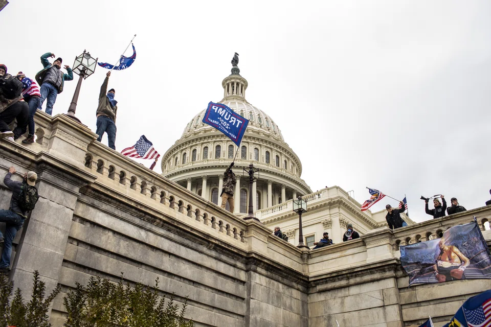 Supporters of former President Donald Trump climb the walls of the US Capitol in Washington, United States, Jan 6, 2021. US District Judge Timothy Kelly sentenced Michael Sparks, the first rioter to enter the US Capitol that day, to 53 months in prison and a US$2,000 fine.