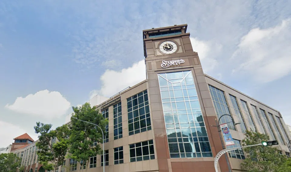 Four-storey Stamford Court has a distinctive clock tower on the building’s granite and glass facade. 