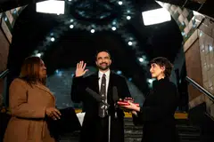 Zohran Mamdani is sworn in as mayor of New York City shortly after midnight on Jan 1.  He is flanked by his wife, Rama Duwaji, (right) and New York Attorney-General Letitia James.