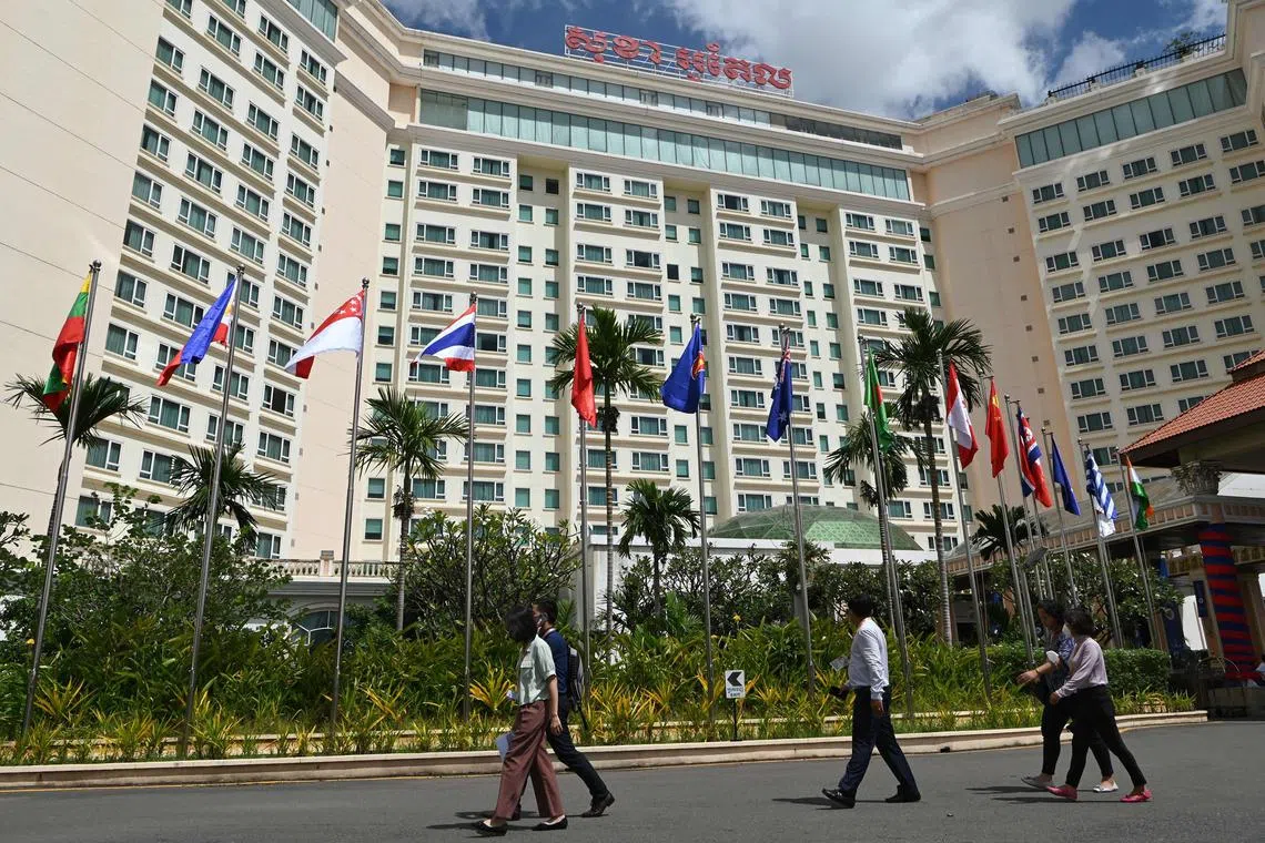 People walk in front of the Sokha hotel during the 55th ASEAN Foreign Ministers’ Meeting in Cambodia in August. As a whole, Asean has remained an attractive investment destination despite the decline in foreign direct investment during the pandemic. 