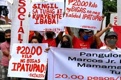 Protesters staging a rally  in Manila to urge new Philippine President Ferdinand Marcos Jr to bring down the price of rice. 