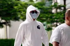 Citibank Singapore former relationship manager Wang Qiming arrives at the State Courts in Singapore on Oct 23, 2025. 