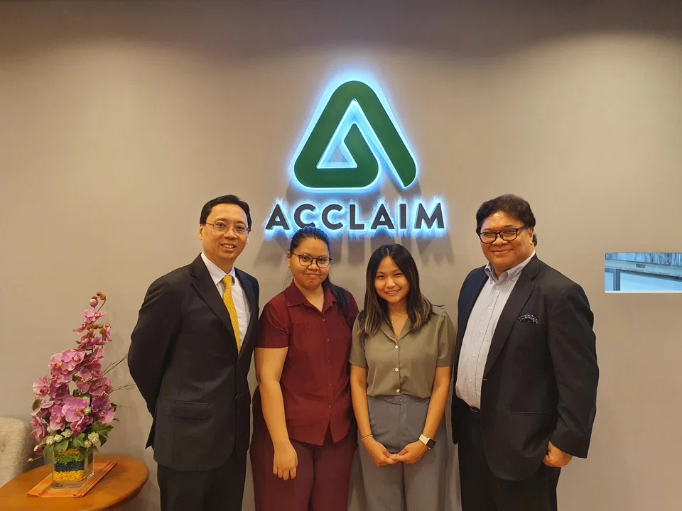 From left: Acclaim chief executive Tony Lim; Acclaim-Heartware Endowment Fund 2021 recipients Dewi Murni binte Musa and Crystal Khoo Jinying; and Acclaim chairman Anthony Lim.
