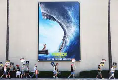 Striking Writers Guild of America members picket with striking SAG-AFTRA members outside Warner Bros Studio on Aug 16, 2023 in Burbank, California. 
