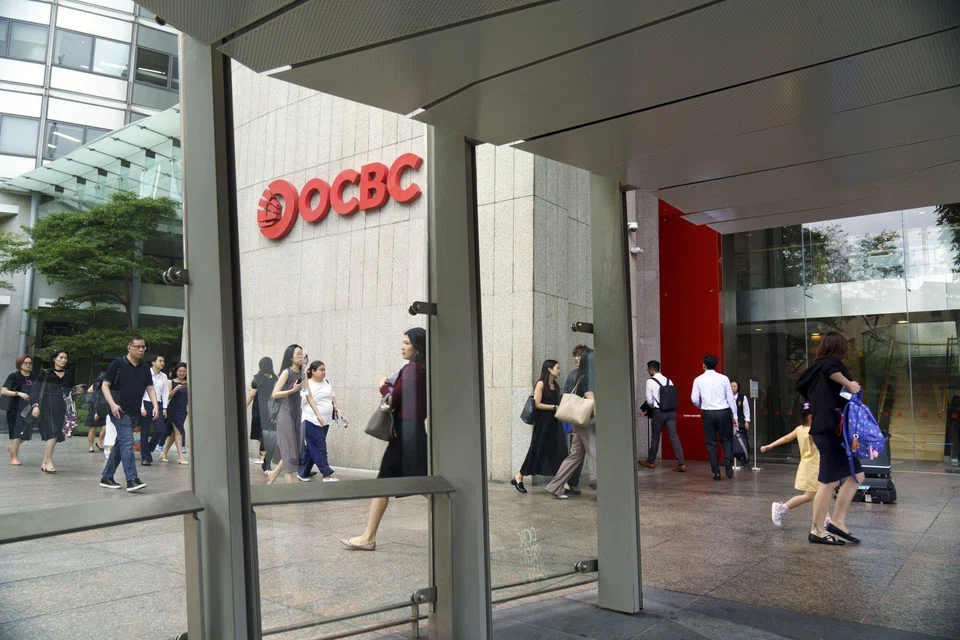 OCBC's third-quarter net profit beats a S$1.79 billion consensus forecast in a Bloomberg survey of five analysts.