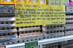 A sign at supermarket Trader Joe's hangs by cartons of eggs in Merrick, New York, Feb 10, 2025. Shipments of eggs to the US from Turkey began this month and will continue until July.