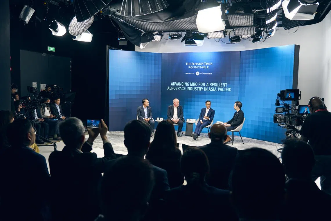 (From left) Zheng Jingxin, Singapore Economic Development Board's vice-president of mobility and industrial solutions; Iain Rodger, GE Aerospace's managing director of component repair in Singapore; Yip Hin Meng, ST Engineering's executive vice-president and head of aerospace MRO; Derryn Wong, The Business Times correspondent.
