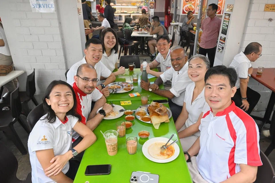 Law and Home Affairs Minister K Shanmugam with incumbent Nee Soon MPs (on the right, from the back) Louis Ng, Carrie Tan and Derrick Goh, who are stepping down - and PAP new faces (on the left, from the back) Lee Hui Ying, Jackson Lam, Dr Syed Harun Alhabsyi and Goh Hanyan at a coffeeshop at 846 Yishun Ring Road on Apr 22.