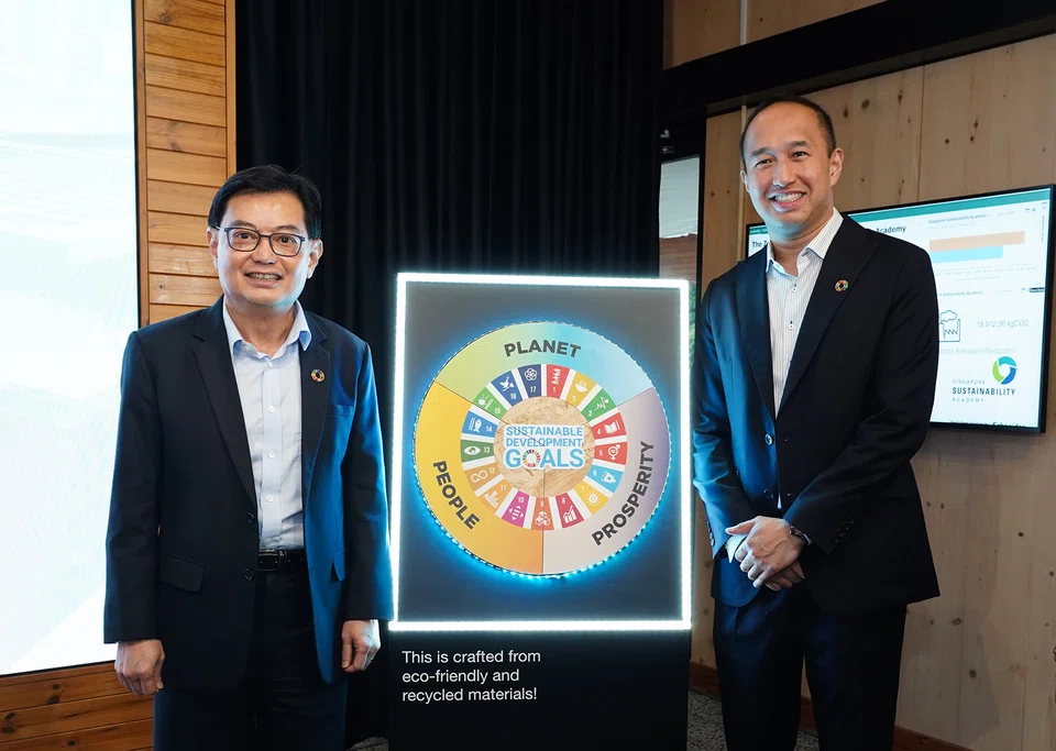 Deputy Prime Minister Heng Swee Keat (left) and CDL group chief executive officer Sherman Kwek highlight the importance of collective action in driving sustainability, at the opening of the Singapore Sustainability Academy Annex.
