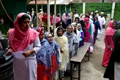 Indian women waiting to cast their votes at a polling station during the first phase of the general election in Imphal, Manipur, on Apr 19.