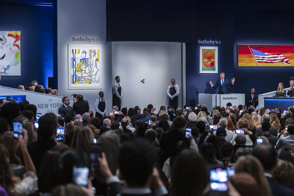 Maurizio Cattelan's conceptual work featuring a banana, being auctioned at Sotheby's in New York on  Nov 20. The work sold for US$6.2 million with fees. 