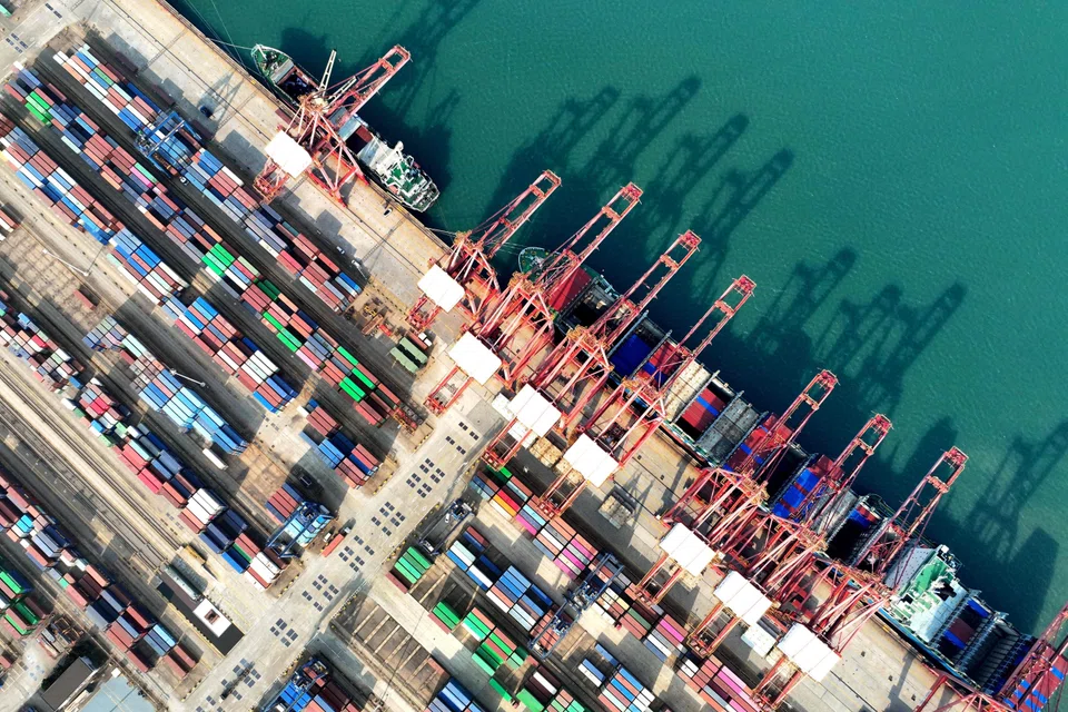 A container ship being loaded at the port in Lianyungang, China. The country's export price index may slump as far as 10% in some months in 2025, which would deliver a big competitive shock to companies that compete with Chinese rivals.
