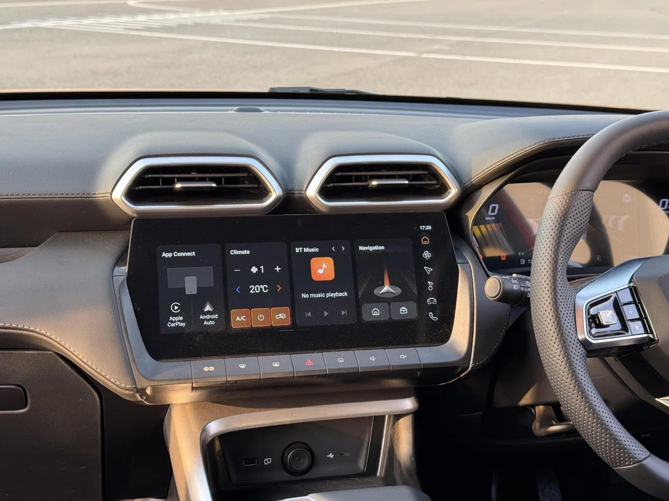 Inside the cabin is a 12.3-inch touchscreen plus a row of physical switches.