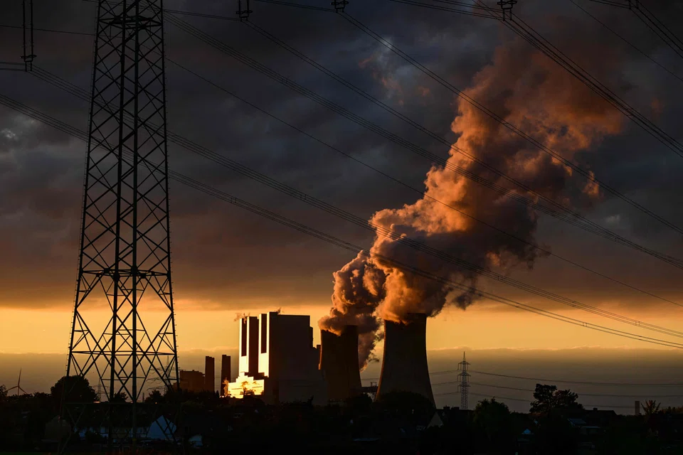 A lignite-fired power station operated by German energy giant RWE in Neurath, Germany. With now a  pressing national security dimension to the energy transition, further measures are needed, including accelerated investments in renewable energy, to reduce world demand for oil. 