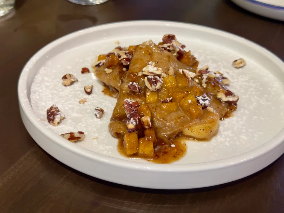 Dessert time: Fluffy thin crepes are drizzled with caramel sauce and paired with sweet plantains and bananas.