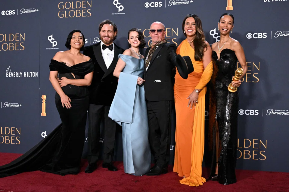 (From left) Adriana Paz, Edgar Ramirez, Selena Gomez, Jacques Audiard, Karla Sofia Gascon and Zoe Saldana pose with the Best Motion Picture - Musical or Comedy award for "Emilia Perez" in Beverly Hills, California, Jan 5, 2025. 