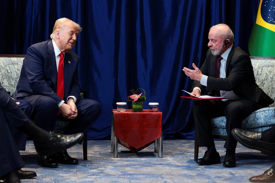 US President Donald Trump and Brazilian President Luiz Inacio Lula da Silva talk as they meet on the sidelines of the 47th Asean summit in Kuala Lumpur.