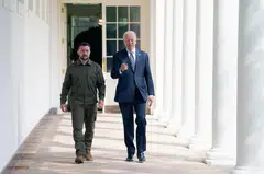 Ukrainian President Volodymyr Zelensky walks down the White House colonnade to the Oval Office with US President Joe Biden during a visit to the White House in Washington, DC, on Sep 21, 2023. 