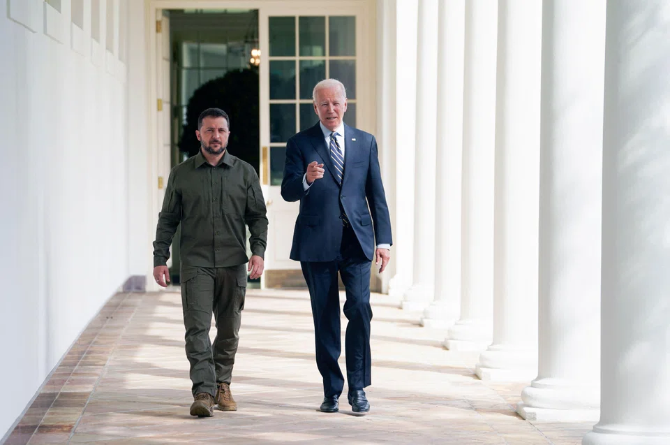 Ukrainian President Volodymyr Zelensky walks down the White House colonnade to the Oval Office with US President Joe Biden during a visit to the White House in Washington, DC, on Sep 21, 2023. 
