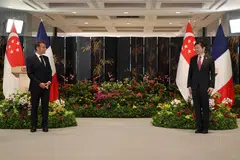 French President Emmanuel Macron (left) with Singapore Prime Minister Lawrence Wong.