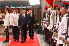 Lao Prime Minister Sonexay Siphandone (front) and Singapore Prime Minister Lawrence Wong at the welcome ceremony at the foyer of Parliament House. Dr Sonexay is on his first official visit to Singapore.