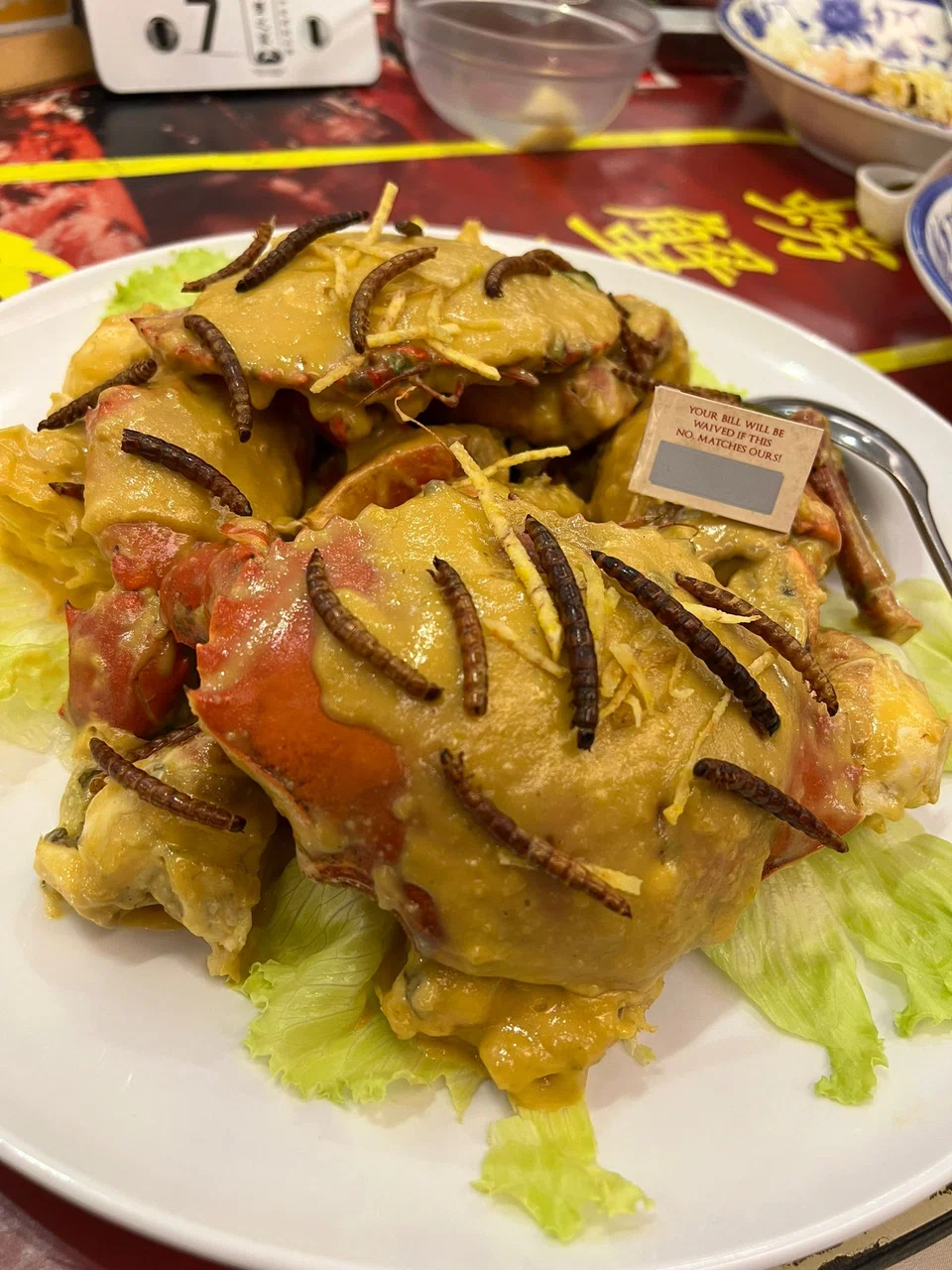 Salted egg crab topped with superworms.