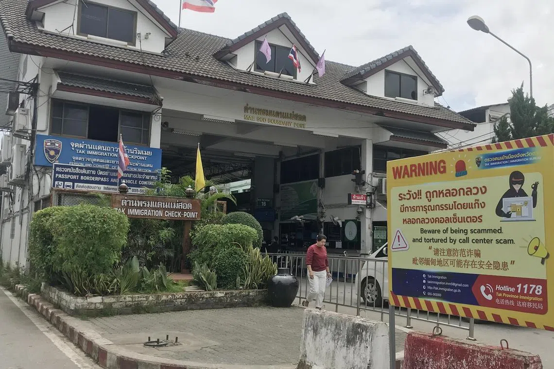 A scam awareness poster at the immigration checkpoint between Thailand and Myanmar in the Thai border town of Mae Sot.