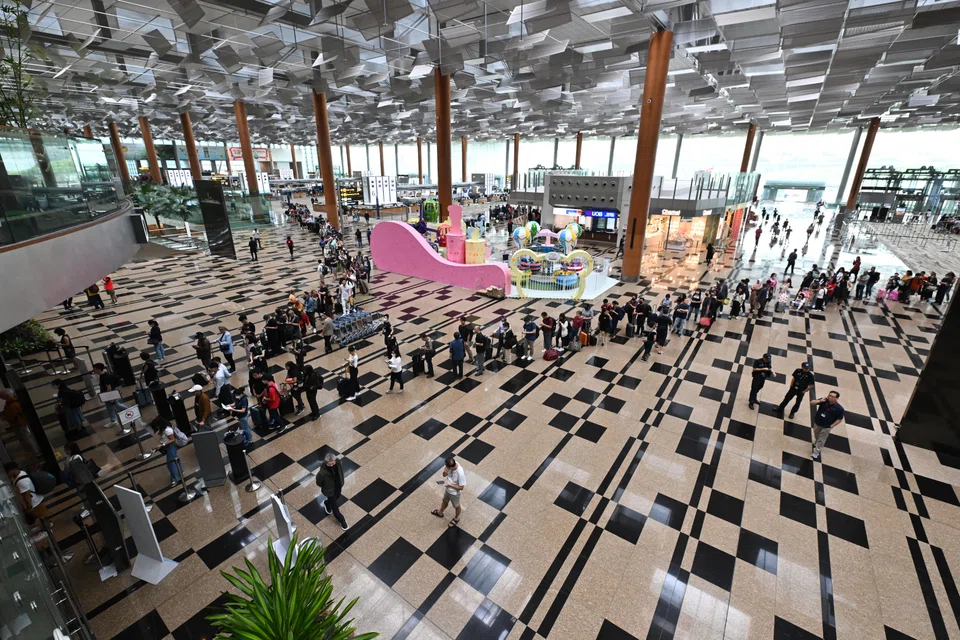 Passengers in the departure hall of Changi Airport Terminal 3 in March. The airport handled 5.12 million passengers in June, crossing the five million mark for the first time since January 2020.