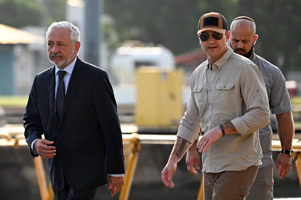 US Secretary of Defense Pete Hegseth (second right) visits the Miraflores locks of the Panama Canal. accompanied by Panama Canal Administrator Ricaurte Vasquez (left) in Panama City, Panama, April 8, 2025. 