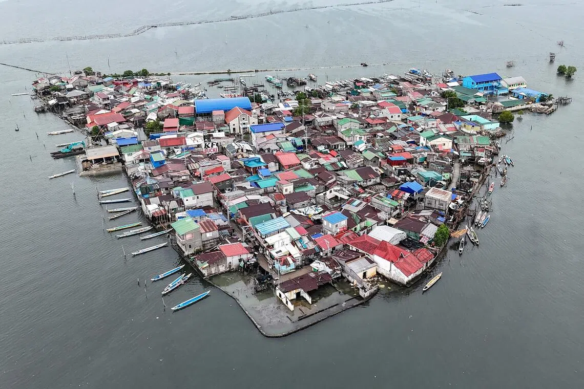 An aerial view of Isla Pugad in the Philippines' Bulacan province to the north of Manila. Sea levels in the archipelago are rising three times faster than the global average of 3.6 mm a year. 