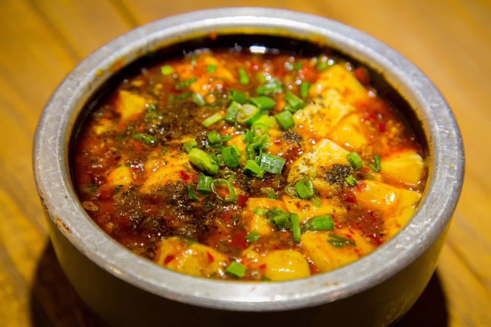 In mapo tofu, a Sichuanese favourite, chewy nubs of ground beef or pork swimming in a fiery sauce complement silken tofu’s yielding delicacy. 