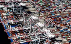 An aerial view of a container ship and shipping containers at the Port Of Long Beach in California. In the wake of the tariffs, economists have warned that Liberation Day has made a US recession more likely.