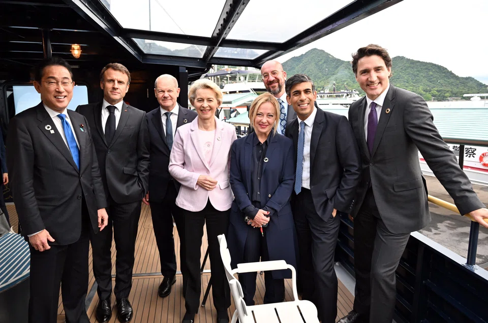 Japan's Prime Minister Fumio Kishida (first from left) and some G7 leaders on a boat trip to visit the Itsukushima Shrine on Miyajima island, on May 19 during the G7 Hiroshima Summit in Japan.
