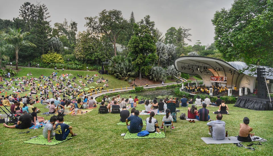 People enjoying a concert at the Singapore Botanic Gardens,  a World Heritage Site. Access to arts and culture plays a part in enlivening the city.