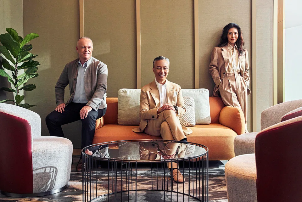 From left: Craig Bond, Choe Peng Sum and Celine Du make up the hotel group's dream team of leaders. Bond wears a jacket from Tod's and shoes from Loro Piana; Choe dons a blazer and trousers from Zegna, and shoes from Tod's; Du is in a shirt and suit from Loro Piana, with shoes from Tod's.