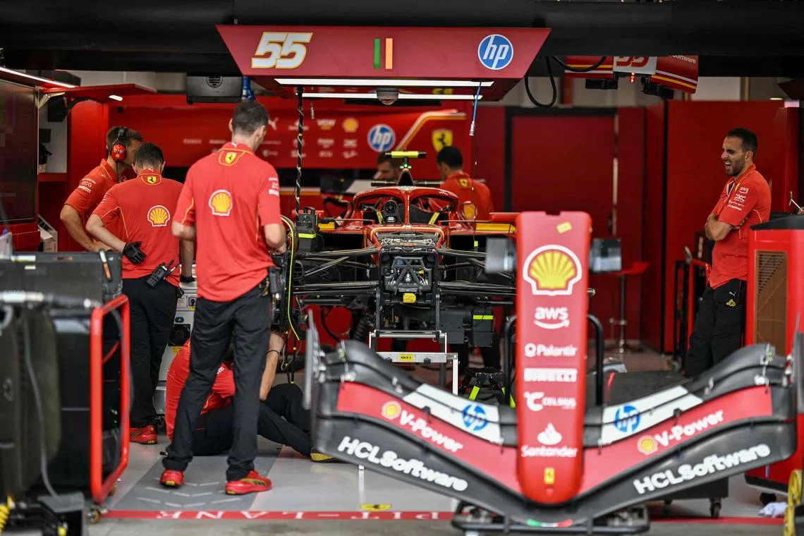 Team mechanics work on the car of Ferrari's Spanish driver Carlos Sainz ahead of the Formula One Singapore Grand Prix night race. Investing, like a professional team sport, requires a well-constructed and diversified portfolio tailored to your investment objectives and risk profile.