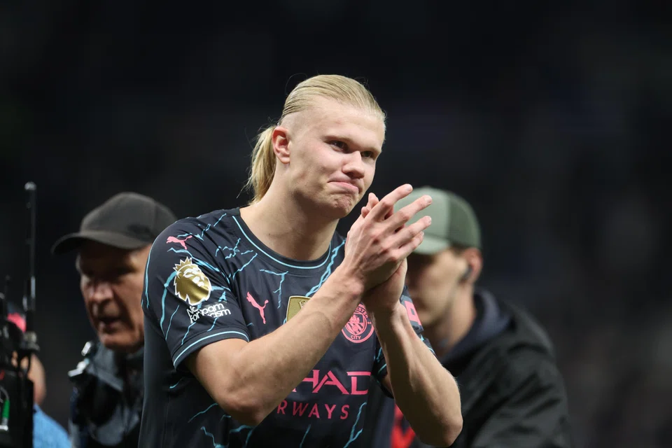 Manchester City's Erling Haaland salutes supporters after winning the English Premier League soccer match between Tottenham Hotspur and Manchester City, in London, Britain, 11 May 2024. Pep Guardiola’s men have dropped just six points since mid-December, in draws against Chelsea, Liverpool and Arsenal.