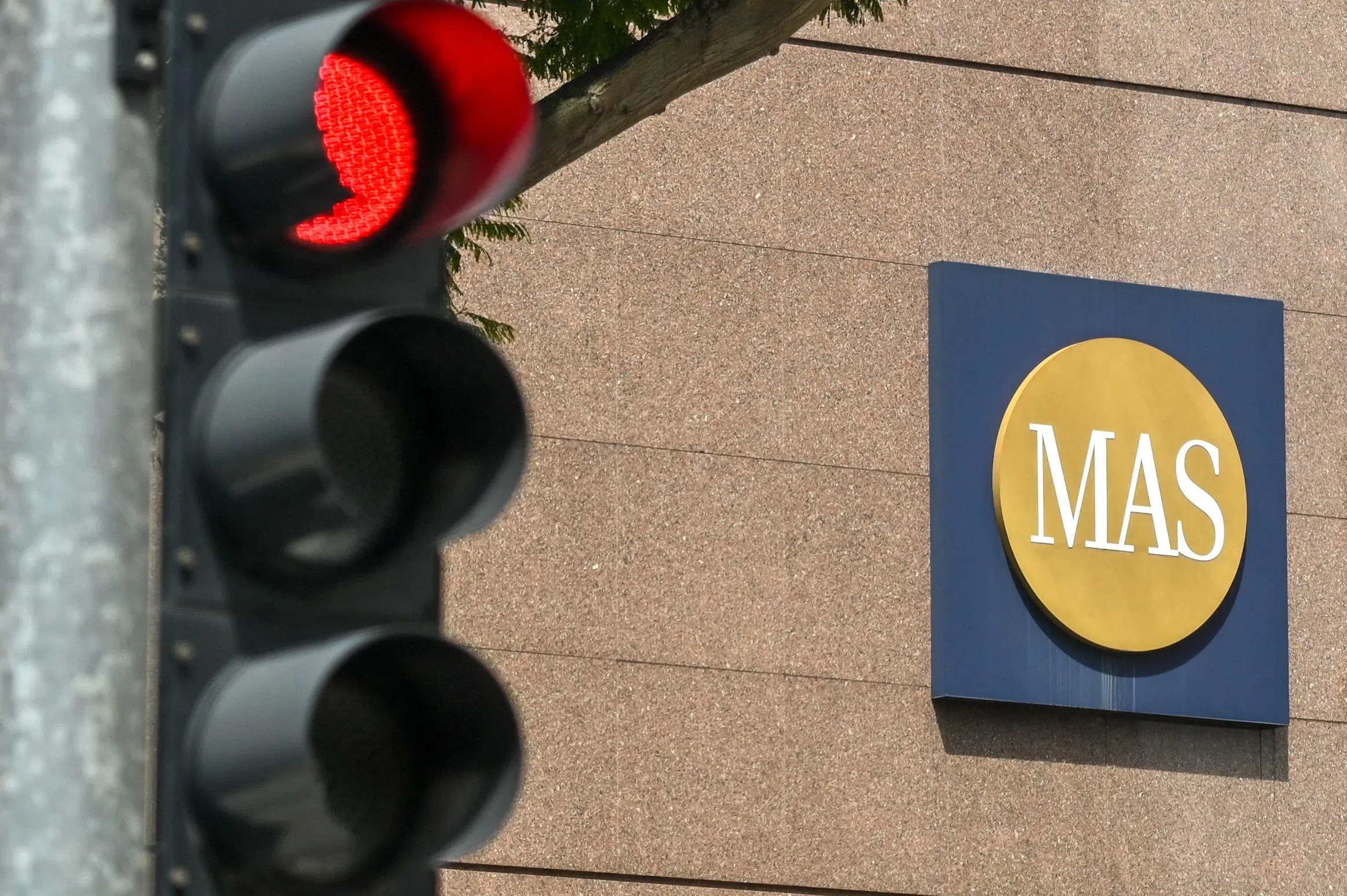 MAS eases policy slightly, lowers inflation forecasts after Trump tariffs  threaten growth - The Business Times