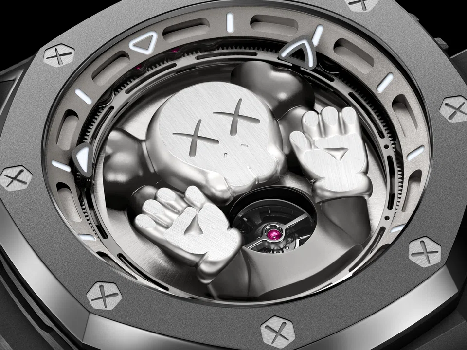 Kaws’ iconic character, Companion, playfully peers out from beneath the sapphire crystal of the Audemars Piguet Royal Oak Concept Tourbillon “Companion”.