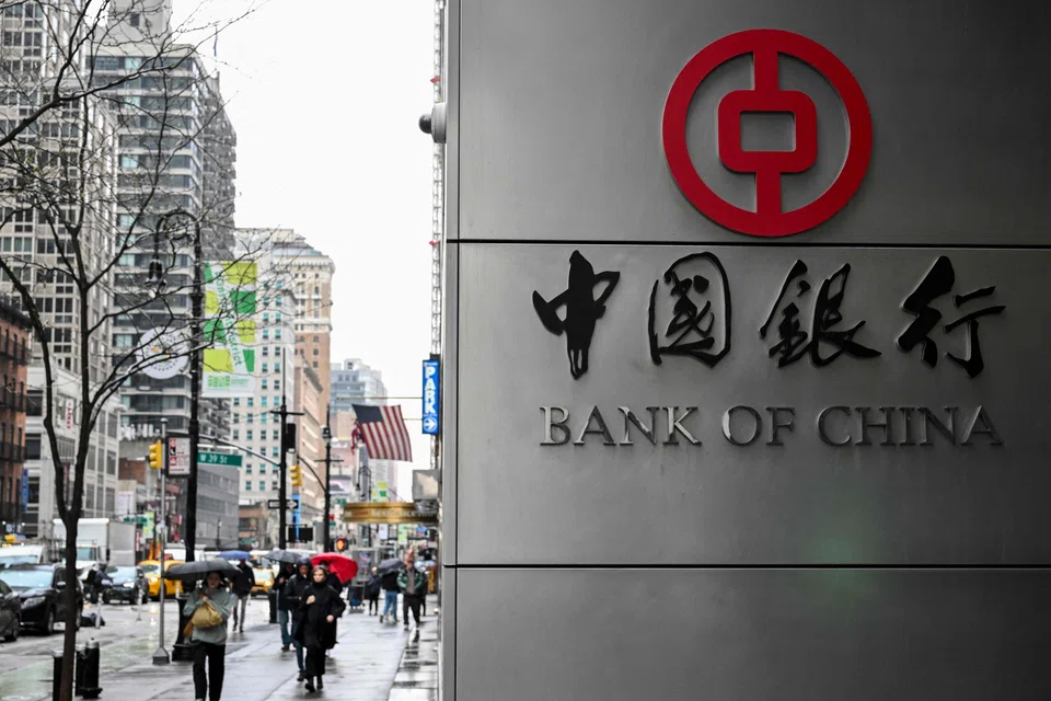 People walk past a Bank of China branch in New York City, New York, April 11, 2025.