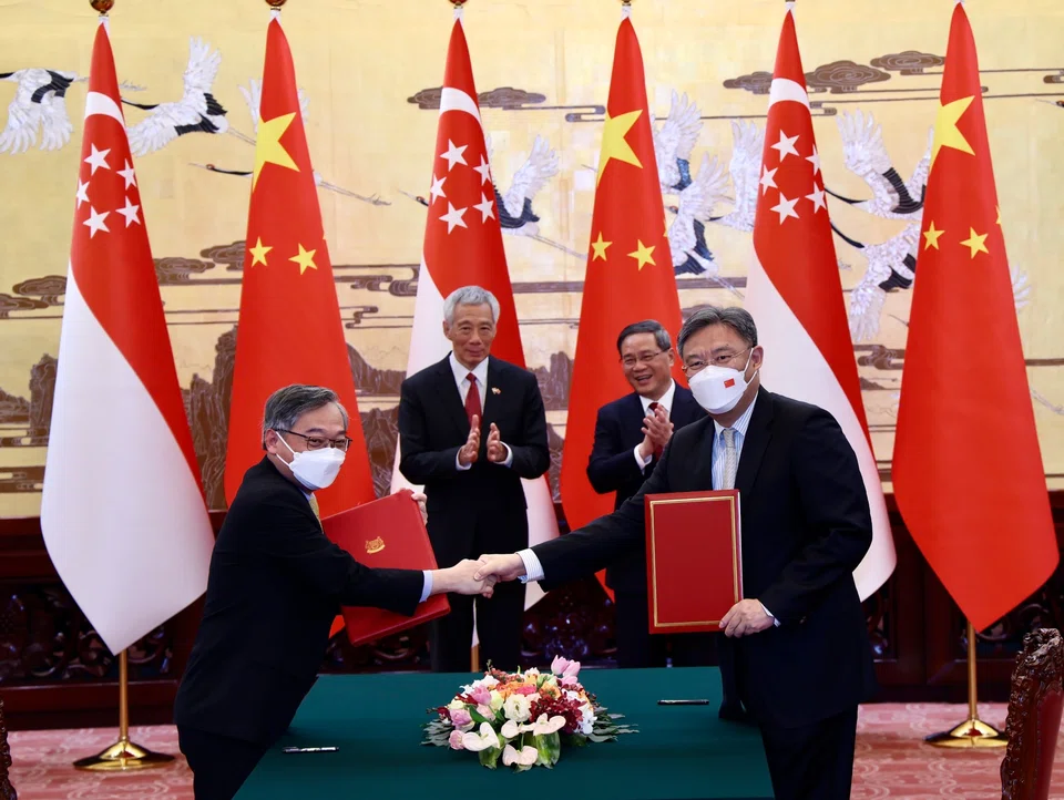 From left: Minister for Trade and Industry Gan Kim Yong; then-PM Lee Hsien Loong; Chinese Premier Li Qiang; and Chinese Minister of Commerce Wang Wentao in Beijing in April 2023. DPM Gan was accompanying former PM Lee on an official visit to China at the time. 