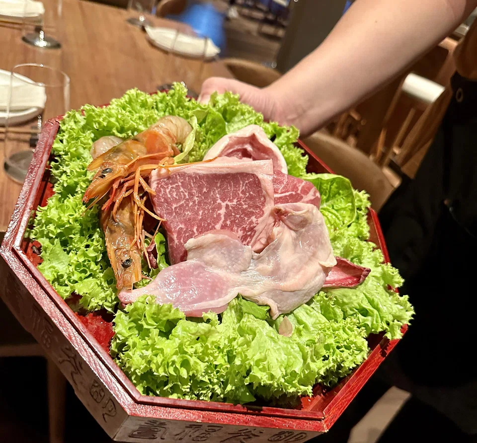 A parade of raw meats appears before your meal.