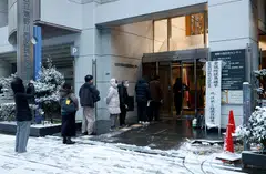 Voters line up at a polling station to vote for the Lower House election in Tokyo, Japan on Feb 8.