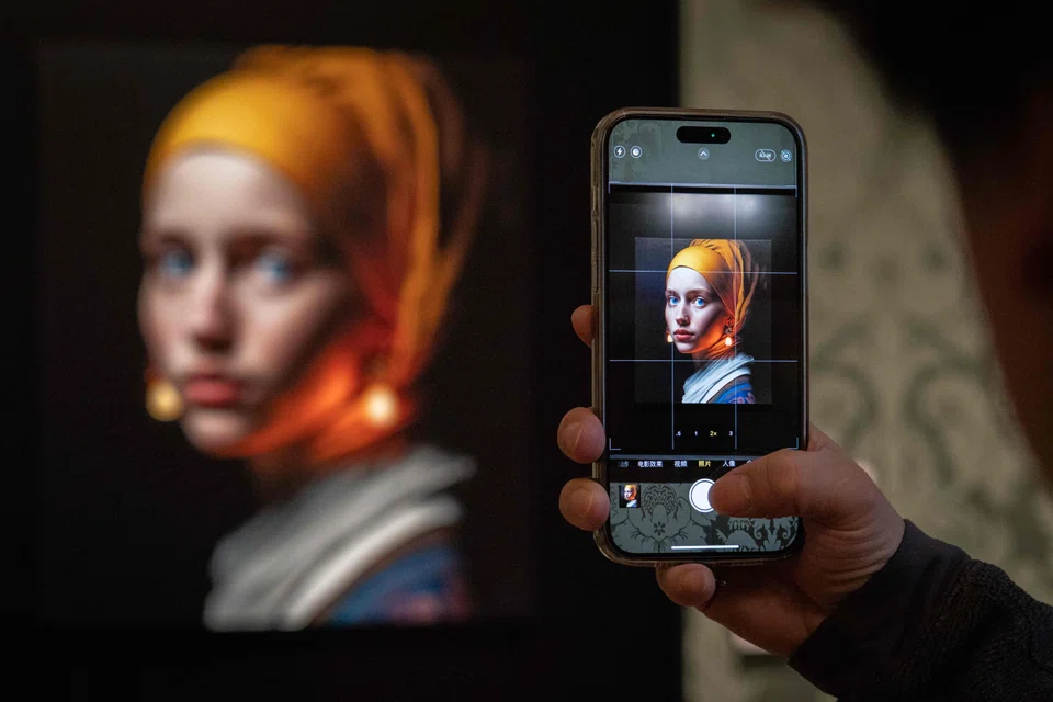 Johannes Vermeer's famous painting "Girl with a Pearl Earring" inspired this image (above), created by artificial intelligence by Berlin-based digital creator Julian van Dieken, and displayed at the Mauritshuis museum in The Hague. 