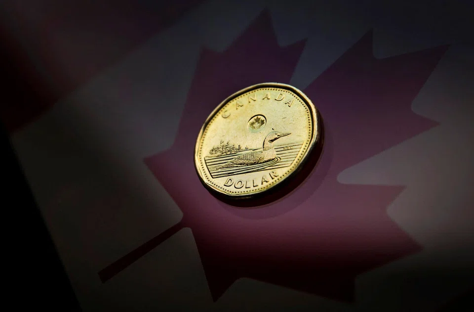 The loonie was trading nearly unchanged at 1.3560 to the US dollar, or 73.75 US cents,
