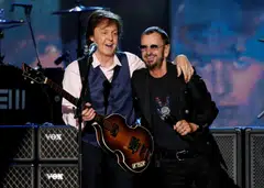 The song also features parts recorded by surviving members Paul McCartney (left) and Ringo Starr (right) as well as the late George Harrison.