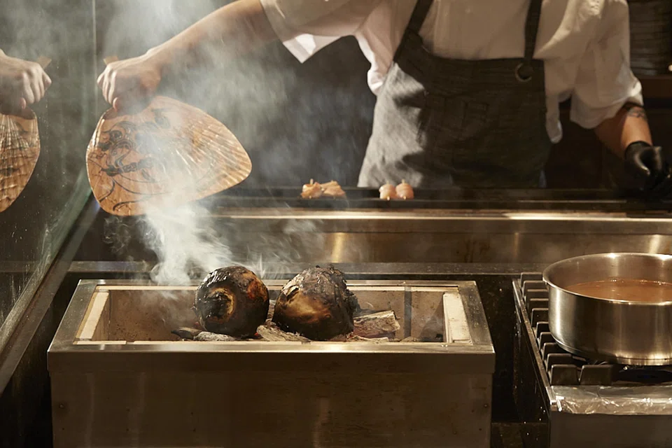 Hanazen's kitchen takes up the bulk of the space, with two facing charcoal grills.