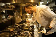 Turkish chef Serhat Karanfil works in the kitchen of Woohoo, an AI-powered restaurant in Dubai. 