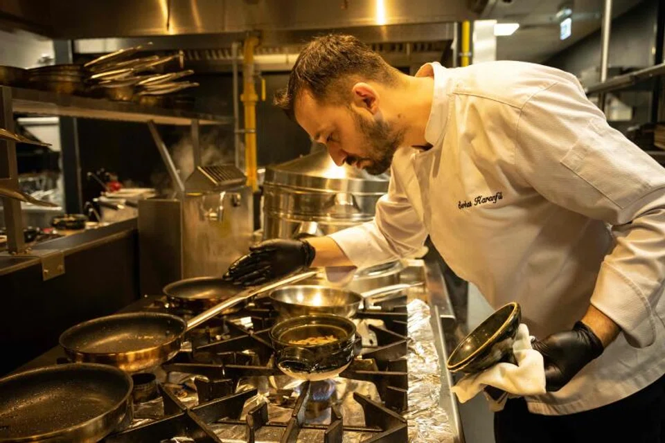 Turkish chef Serhat Karanfil works in the kitchen of Woohoo, an AI-powered restaurant in Dubai. 